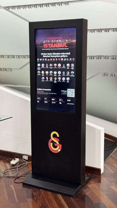 The day’s speakers on the screen in the foyer