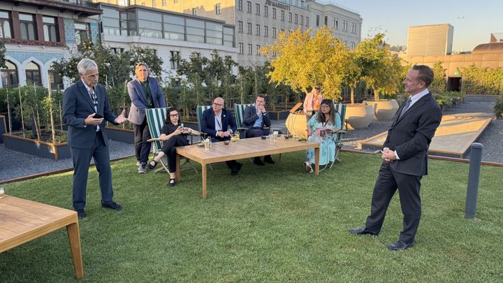 The delegation on the lawn as the sun goes down